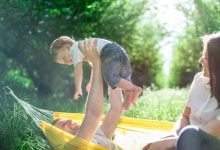Family relaxing on the hammock after a long summer
