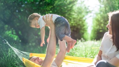 Family relaxing on the hammock after a long summer