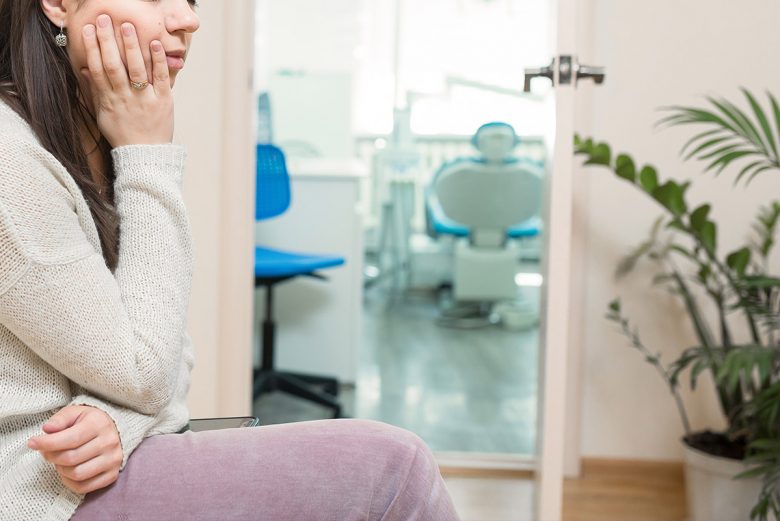 Woman nervous outside of treatment room