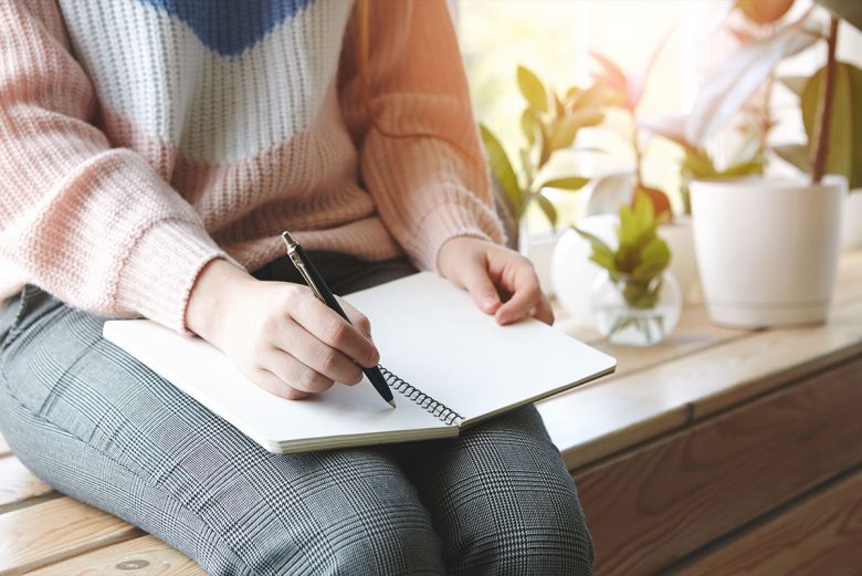 Woman journaling in a quiet space