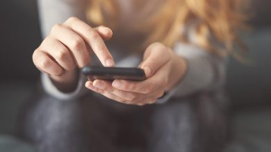 Do you need a social media cleanse? woman holding phone